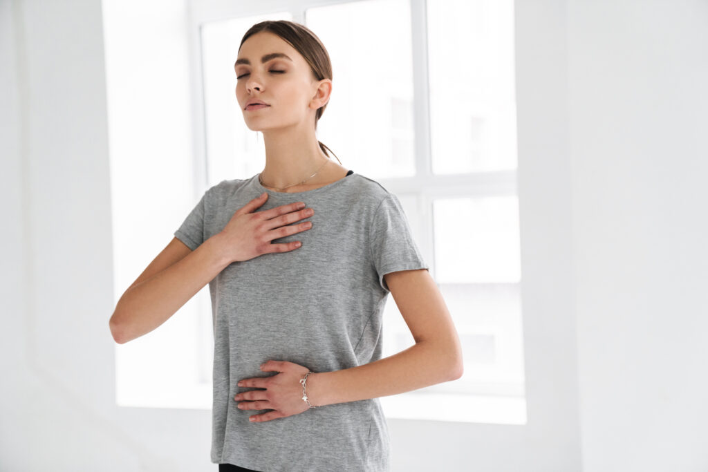 Woman Practicing Breathing Exercises